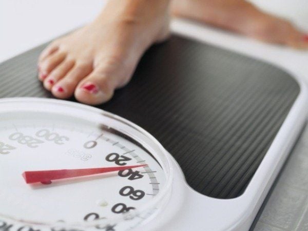 lady checking for weight gain