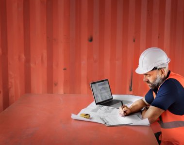 Architect using cloud software on construction site
