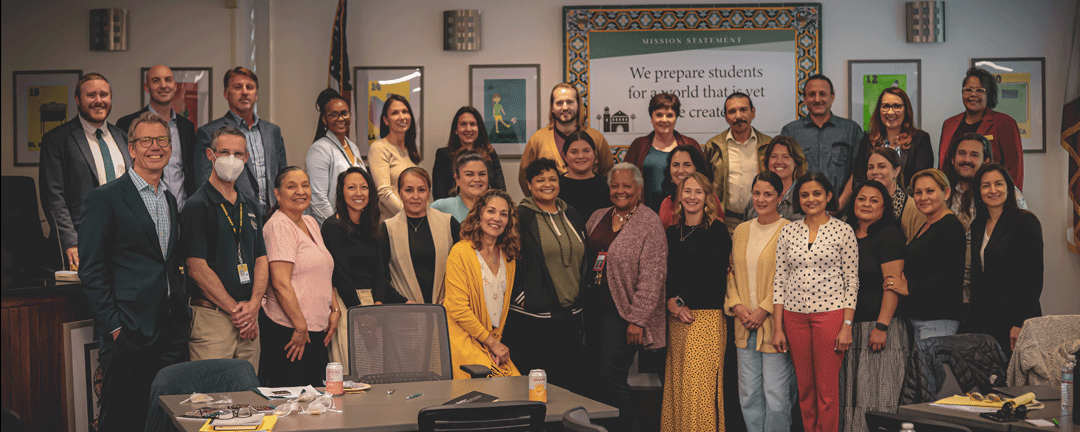 Staff who completed the Aspiring Leaders Academy pose for a group photo.