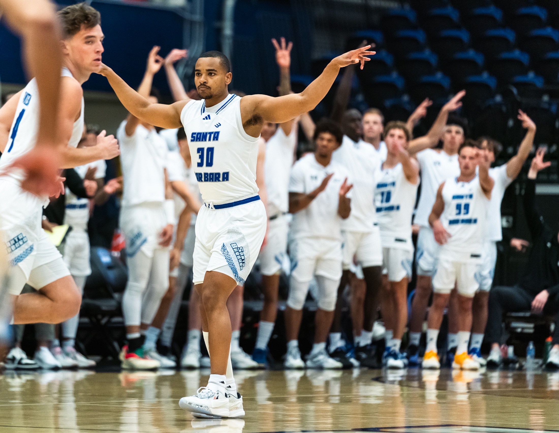 Stephan Swenson celebrates a three-pointer during UCSB’s Senior Night basketball game against UC Irvine. The Gauchos were outscored 34-12 after Swenson fouled out with 7? minutes remaining.