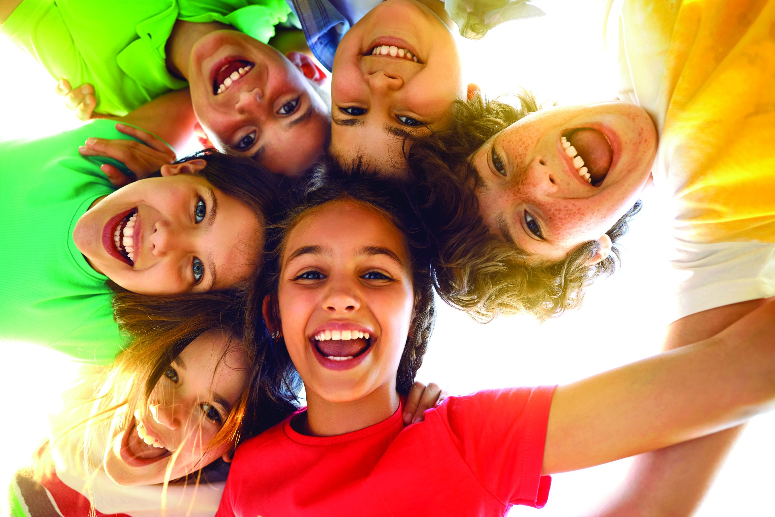 Bunch of cheerful children playing together and having fun.