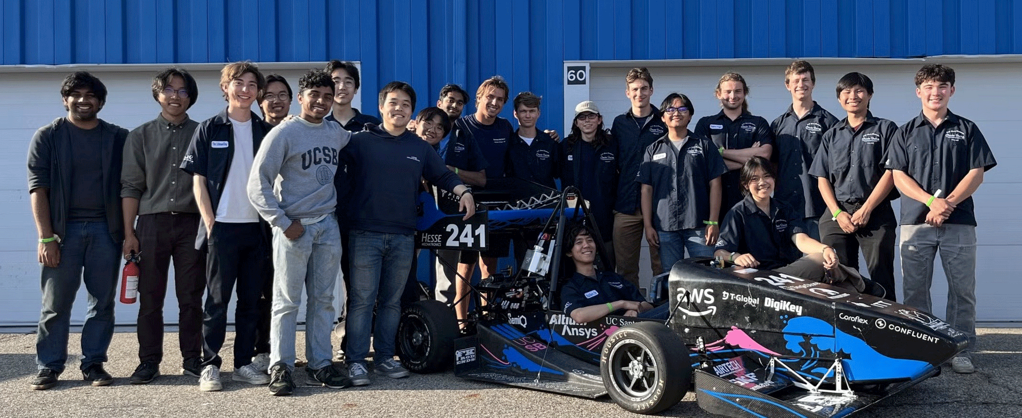 Members of Gaucho Racing pose with their electric F1 vehicle at Michigan International Speedway. (Courtesy photo)