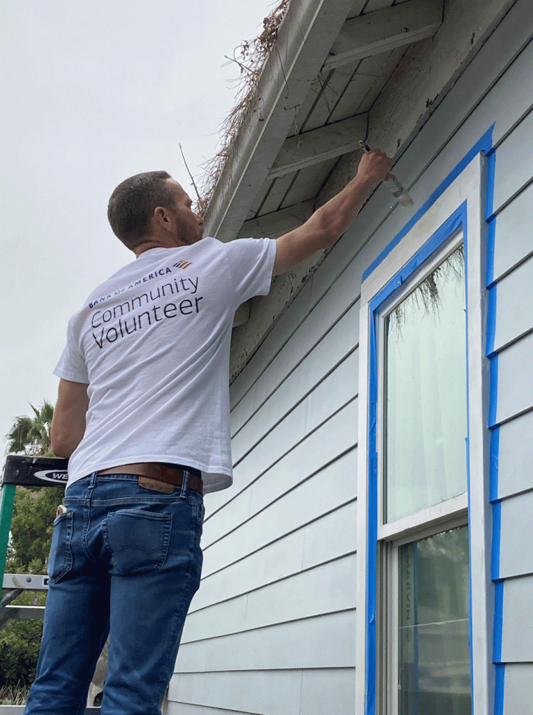 Bank of America teammate Michael Cerniga paints the outside of a home in Santa Barbara part of the bank’s partnership with Habitat for Humanity of Southern Santa Barbara County. (Courtesy photo)