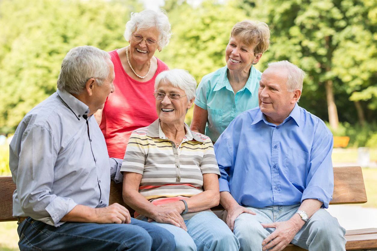 Group of senior friends laughing and talking
