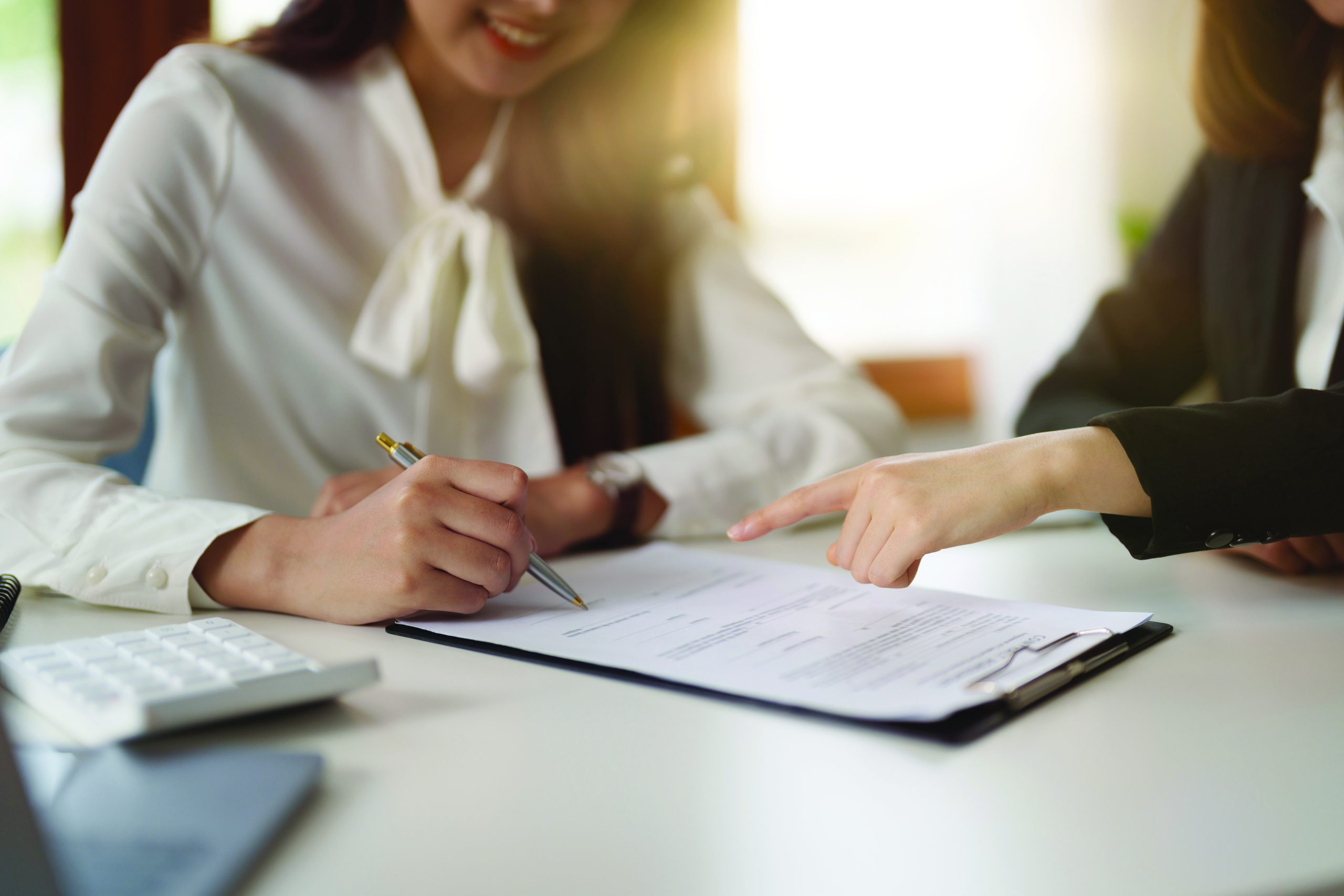 Real estate agent offer hand for customer sign agreement contract signature for buy or sell house. Real estate concept contact agreement concept
