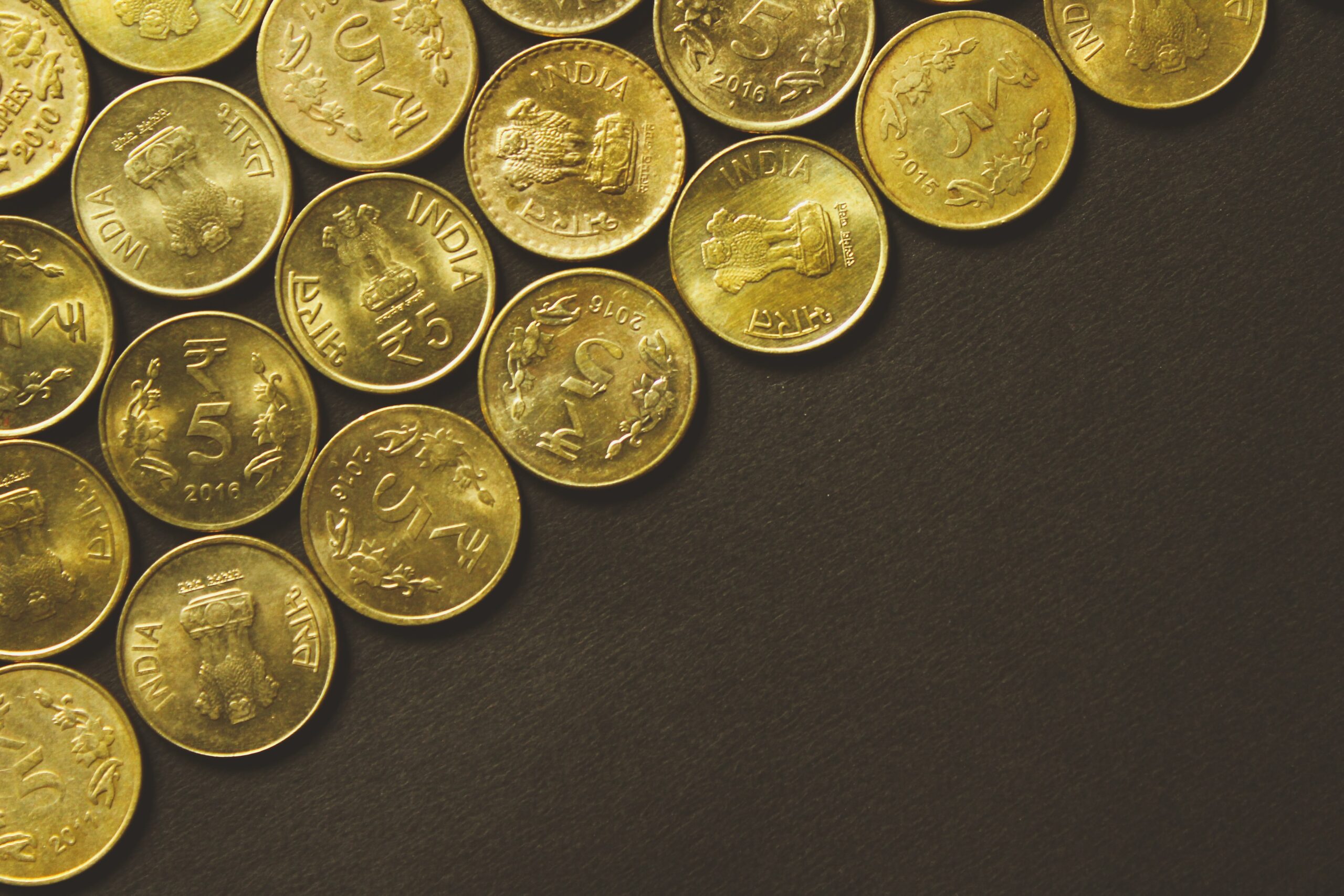 Indian 5 Rupee Coins representing Numberslides Operating Profit Blog Post