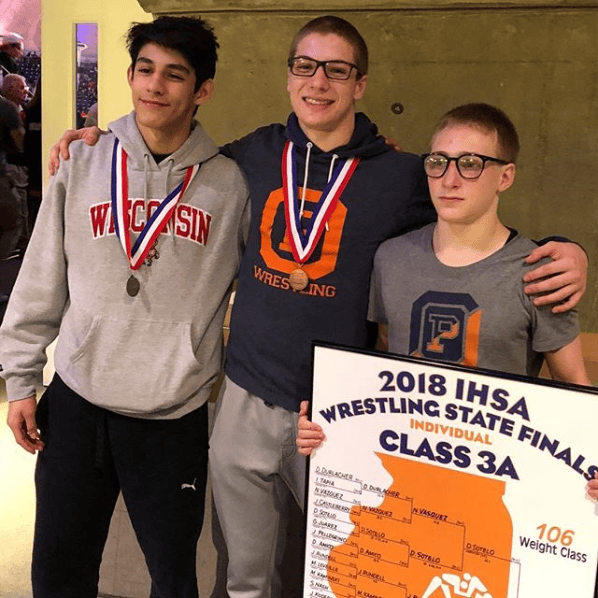 OPRF individual state medalists (left to right) Eddie Bolivar, Joe Chapman and 106-pound state champ Jake Rundell led the Huskies to a 60-7 victory over Maine South in the Sweet 16 round of the IHSA dual team state tournament. (Photo by Jamil Smart)
