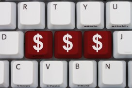 Making Money online, A gray computer keyboard with the dollar sign symbols in red letters
