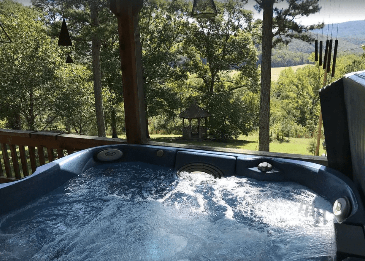 Even on a cold winter day, an outdoor hot tub offers an ideal place to relax. These Cabins In Arkansas All Have Outdoor Hot Tubs