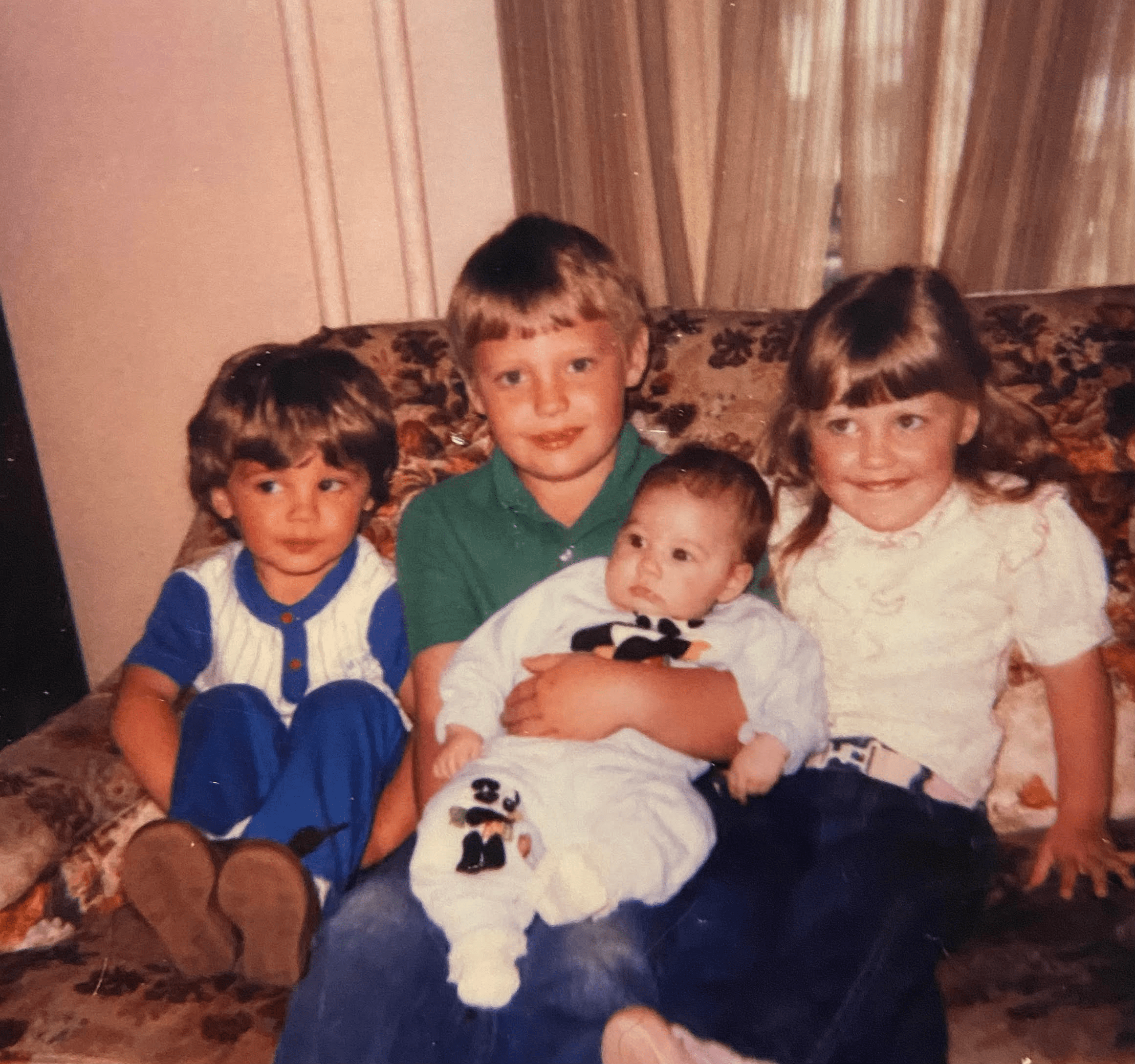 Sitting on Grandma's couch with cousins at a family gathering. 