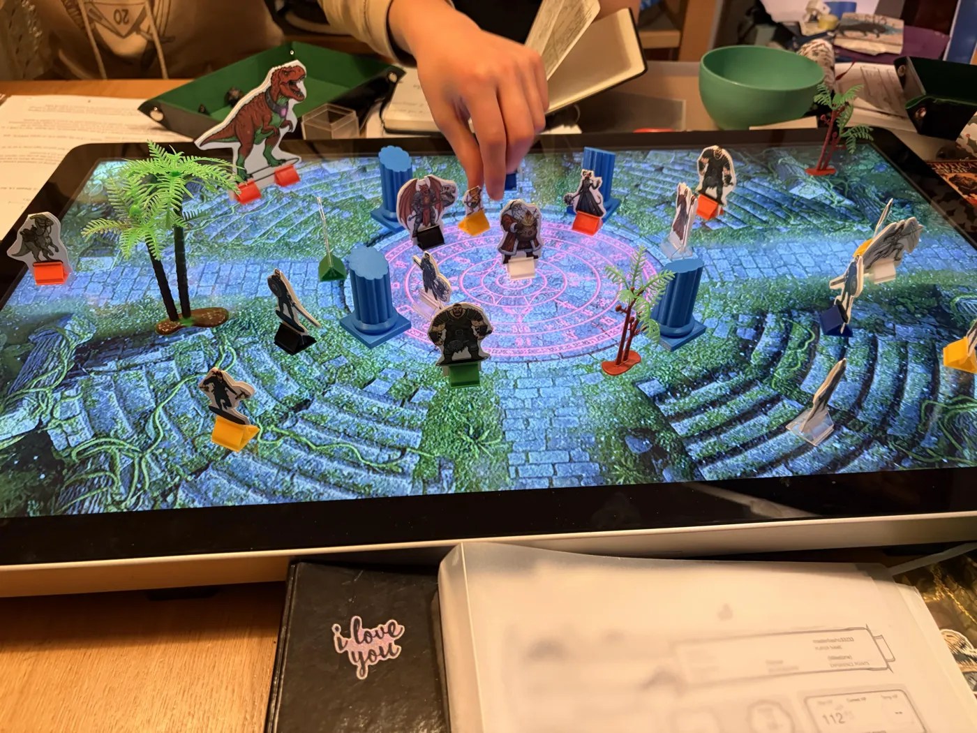 The ritual circle and amphitheatre steps on the map screen, with paper standees placed around it.