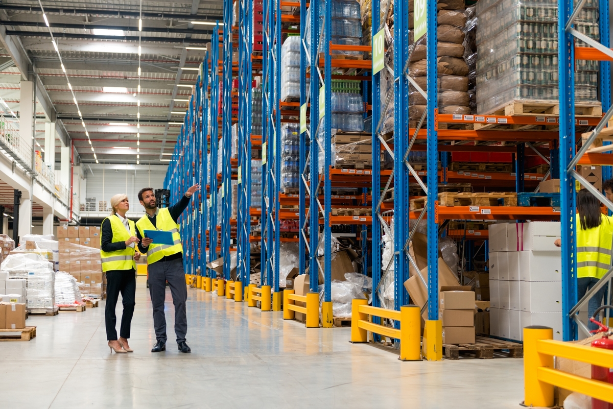 Managers walking thru warehouse