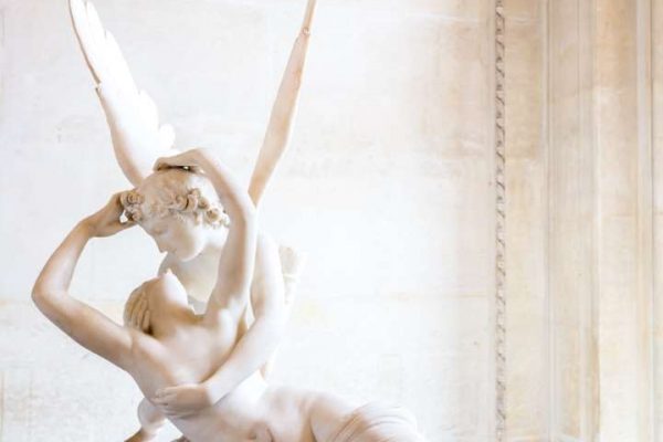 Paris - June 23: Cupid statue on June 23, 2014 in Paris. Antonio Canova's statue Psyche Revived by Cupid's Kiss, first commissioned in 1787, exemplifies the Neoclassical devotion to love and emotion.