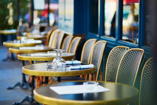 Wine glasses on a table of cozy Parisian outdoor cafe