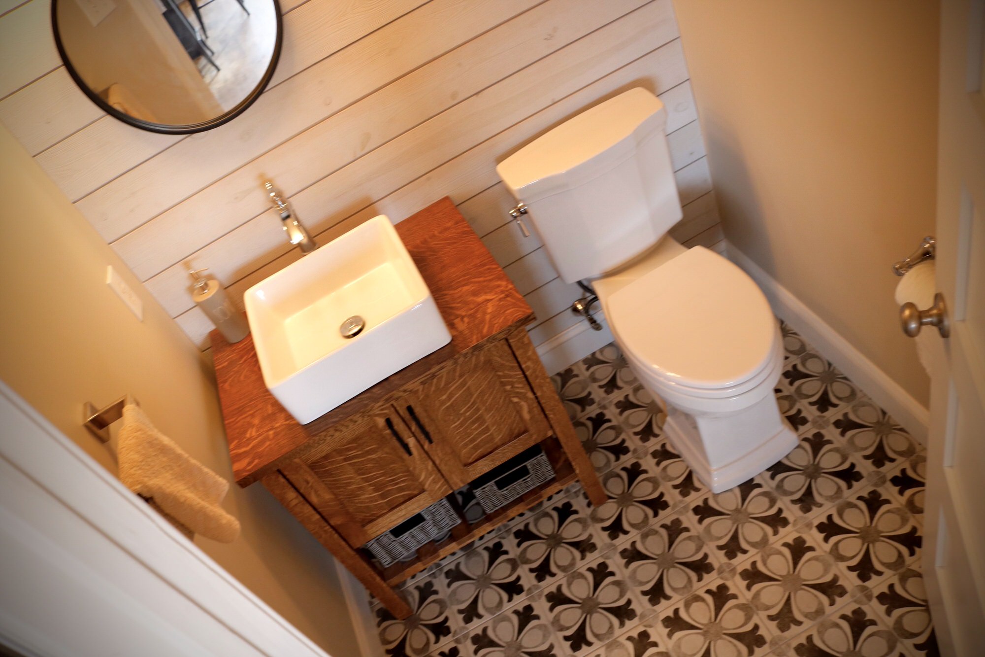 "Farmhouse Powder Room with Pattern Floor and Accent Shiplap Wall, from pdkcontracting.com:"