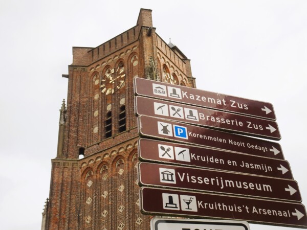 Tower of the Church and Signposts in Woudrichem, Netherlands