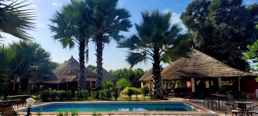 Afropolis Pool and in the background the large guest cabins