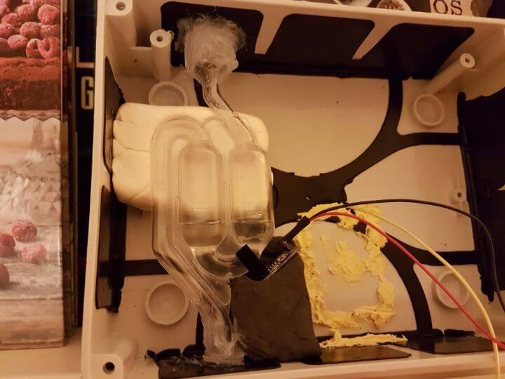 glass tubbing and a temp sensor being help against it with modeling clay