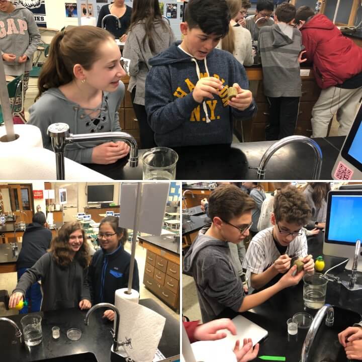 Middle school students working together in a middle school lab room seeding plants in small containers