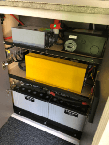 Power cabinet, with two deep cycle 12 volt batteries, a 3000 watt inverter, a 75 amp battery charge