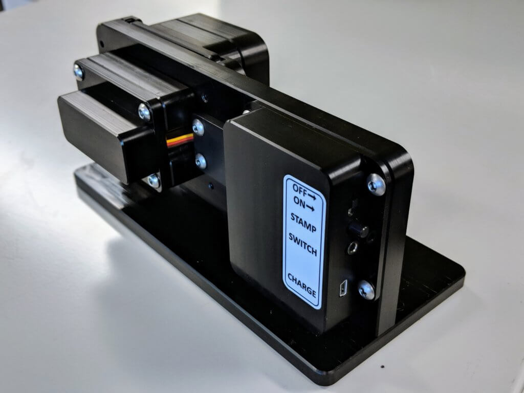 Desktop stamping mechanism with screen in slick hard plastic case, very robust looking