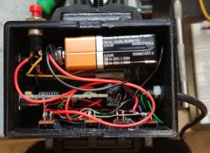 Arduino, wires, and batteries inside an enclosure