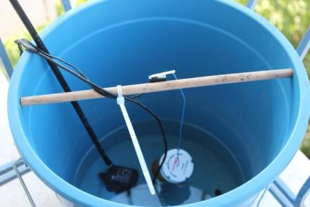 Blue Bucket with water sensor and tubes for Arduino Automated Plant Watering System