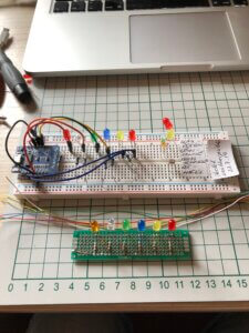 wifi-enabled Arduino weather indicator with LEDs, breadboard, and wires. Very neat.