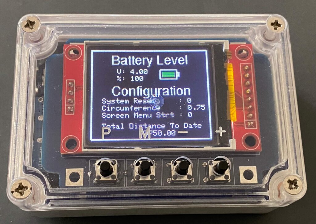 plastic enclosure with buttons and LCD screen showing setup menu - this is called petbit, it's an Arduino fitbit