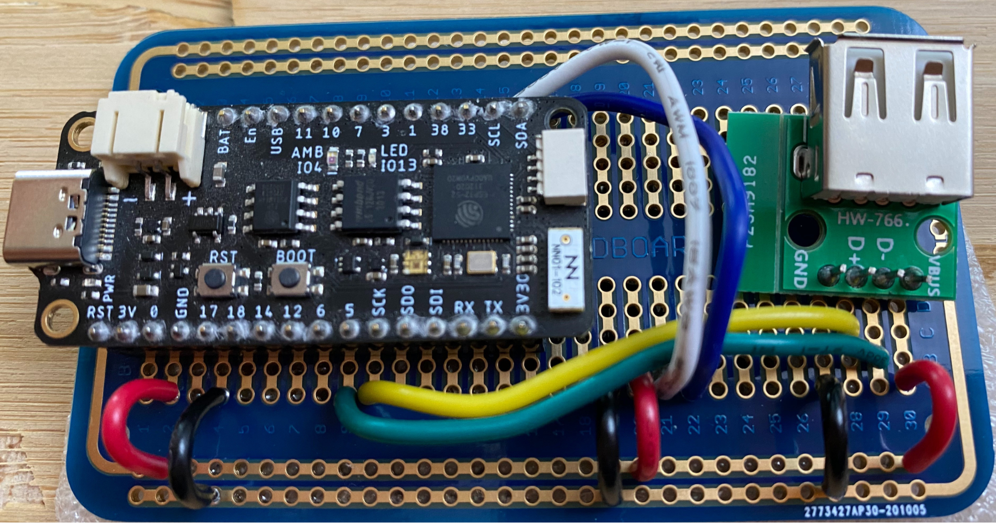 chatGPT terminal protoboard with wires, USB port, and ESP32