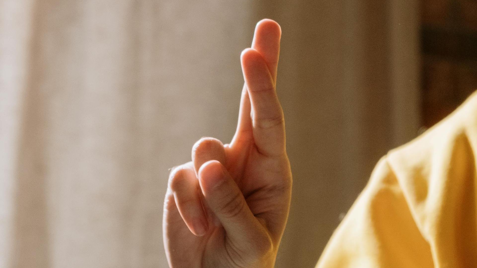 Close up of hand with fingers crossed / Photo via Cottonbro Studios via Pexels / Used under license
