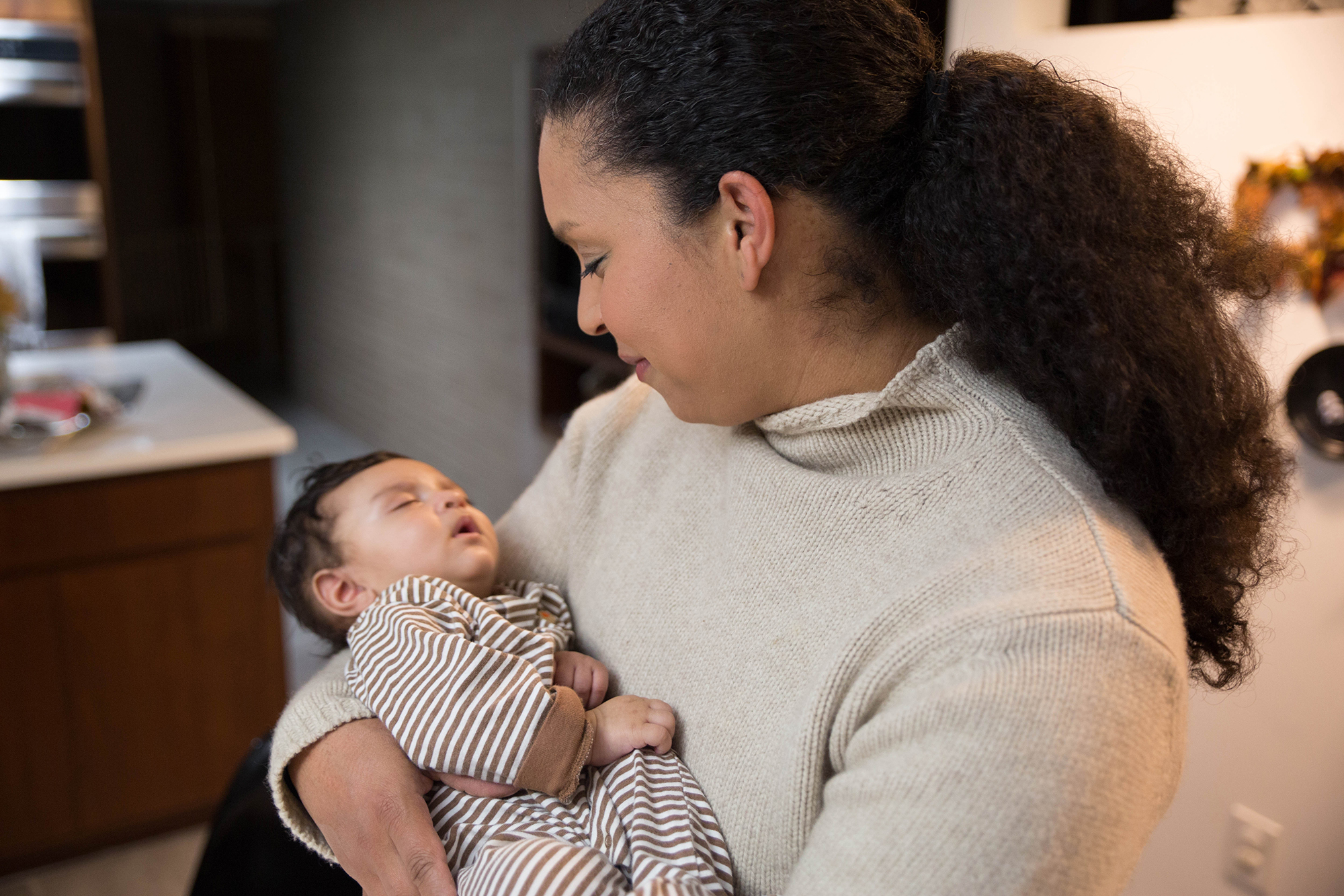 Danielle Sibley holding her son Jordan, who is one of three children. Sibley has experienced seizures and postpartum depression after birth and she was in danger of her uterus rupturing while pregnant. (Photo by Njaimeh Njie/PublicSource)