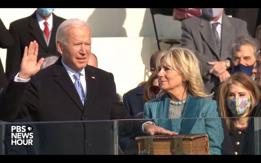 Dr. Jill Biden looks on as President Joe Biden takes his oath of office on Wednesday, January 20, 2021, minutes before noon.