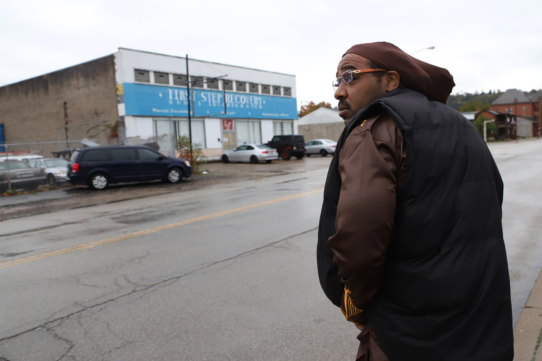 Keenon Mikell, who leads the health and wellness program at First Step Recovery Homes, approaches the nonprofit’s gym on Market Street in McKeesport. (Photo by Ryan Loew/PublicSource)