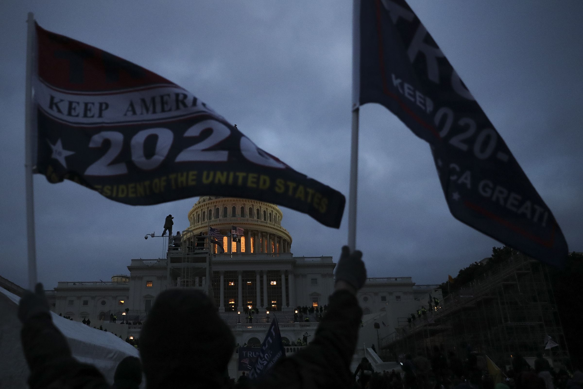 A mob of Trump supporters climbed scaffolding and took to the steps of the U.S. Capitol building in Washington on Jan. 06, 2021.