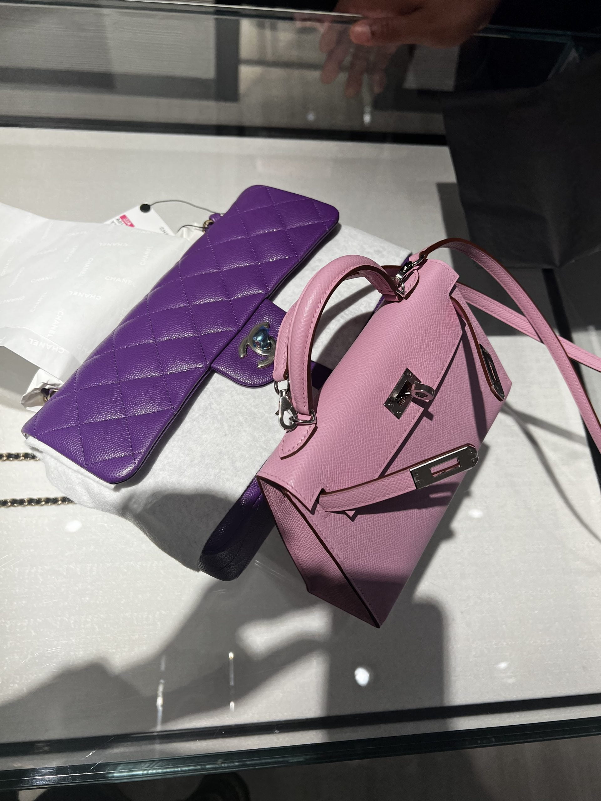 Chanel 22A purple Classic Flap with a Birkin 25 in Bubblegum pink