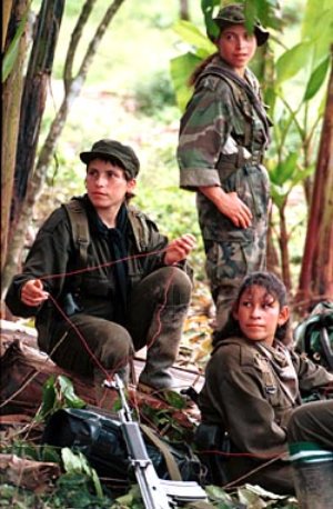 Colombia Farc Project: Three girls members of the Revolutionary Armed Force of Colombia, FARC, rest in a camp near La Macarena, in the rebel controlled area located in southern Colombia. Marcelo Salinas/Special to Chronicle