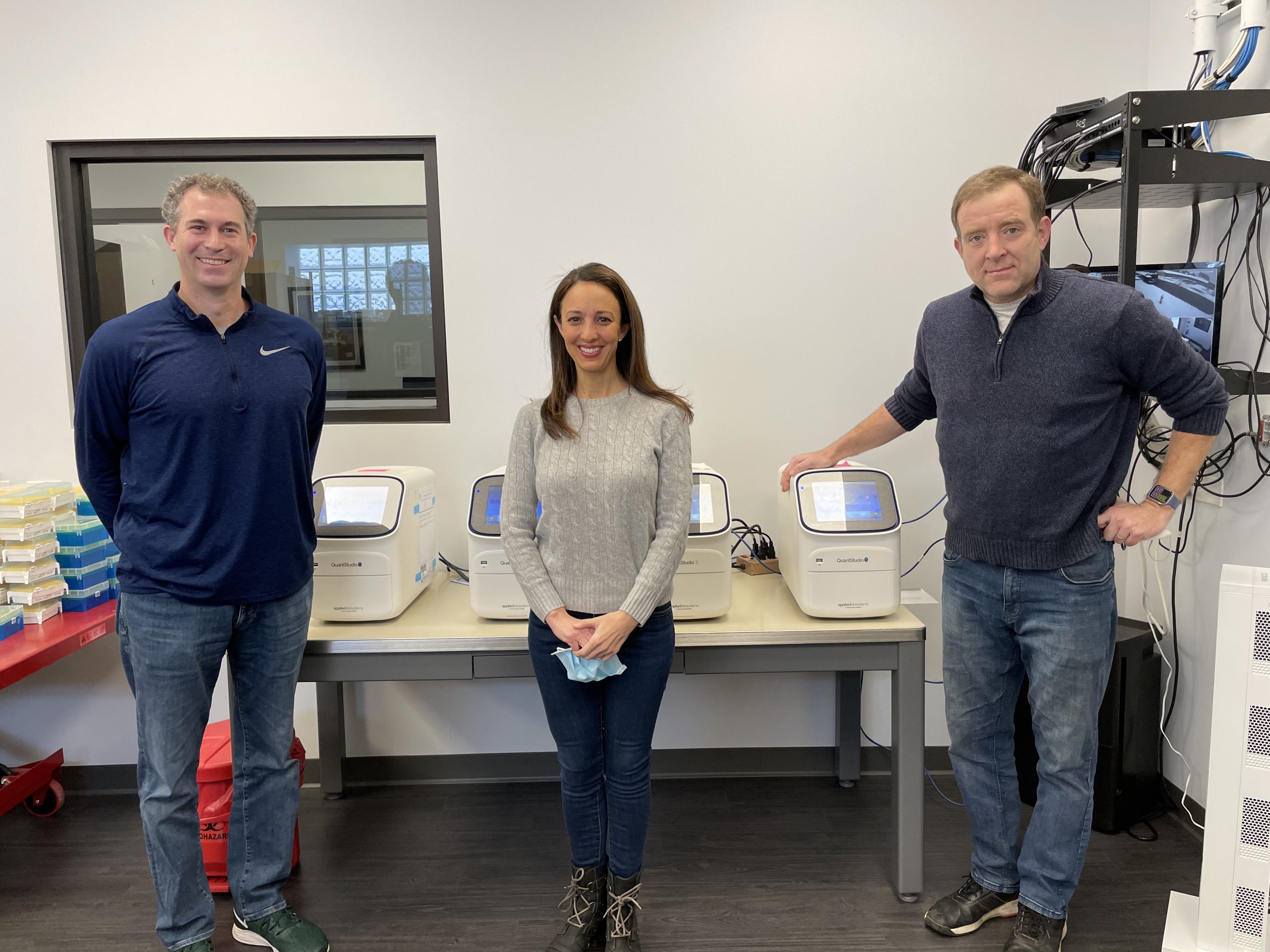 SafeGuard partners (from left) John Carroll, Elyse Hoffenberg and Ed Campbell show off one of the Brookfield lab's PCR machines. (PROVIDED)
