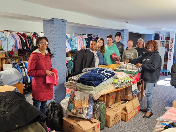 Each November, Orion Communities in Phoenixville holds a Warmth for All coat and blanket drive. Among those helping this year were, left to right, National Honor Society student and volunteer Ashni Kumar, Orion Development Manager Ava King, volunteer Peyton Manogue, Orion case manager Maria Manogue, volunteers Anthony Manogue, Reed Manogue and Deb Gardiner, and board member Janet Gervais. (PHOTO COURTESY OF ORION COMMUNITIES)
