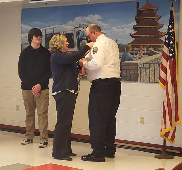 Fire chief Ethan Holmes is pinned with an official badge at a ceremony March 18 at the Wyomissing Fire Department. (Courtesy of Wyomissing Borough)