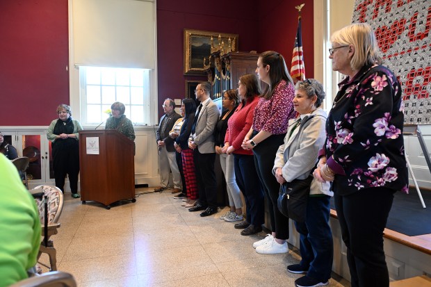 Reading City Council President Donna Reed leads a ceremony on Saturday to reveal the contents of Reading's 250th Anniversary time capsule at the Berks History Center. (BILL UHRICH - READING EAGLE)