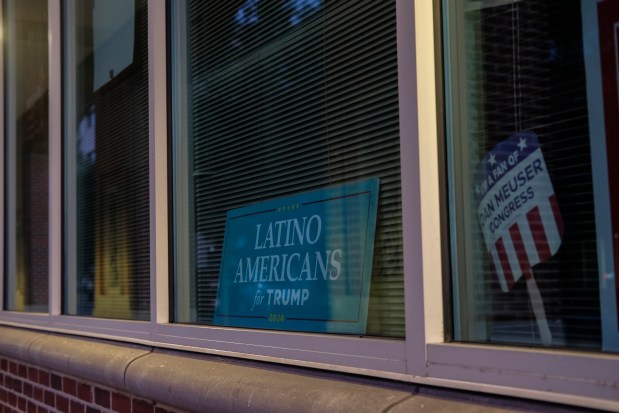 A sign is displayed at the "Latino Americans for Trump" office in Reading, Pa., Sunday, June 16. Political candidates are taking notice of Reading's economic and political power. The 2020 presidential election in Pennsylvania was decided by about 82,000 votes, and - according to the Pew Research Center - there are more than 600,000 eligible Latino voters in the state. (Luis Andres Henao/AP)