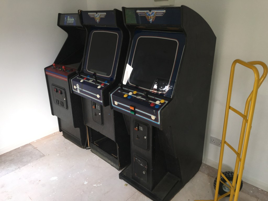 Arcade cabinets lined up in a row