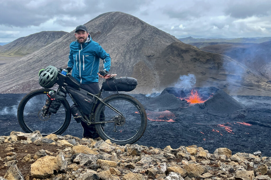 Richard Sidey near an erupting volcano whilst bikepacking the Iceland Divide