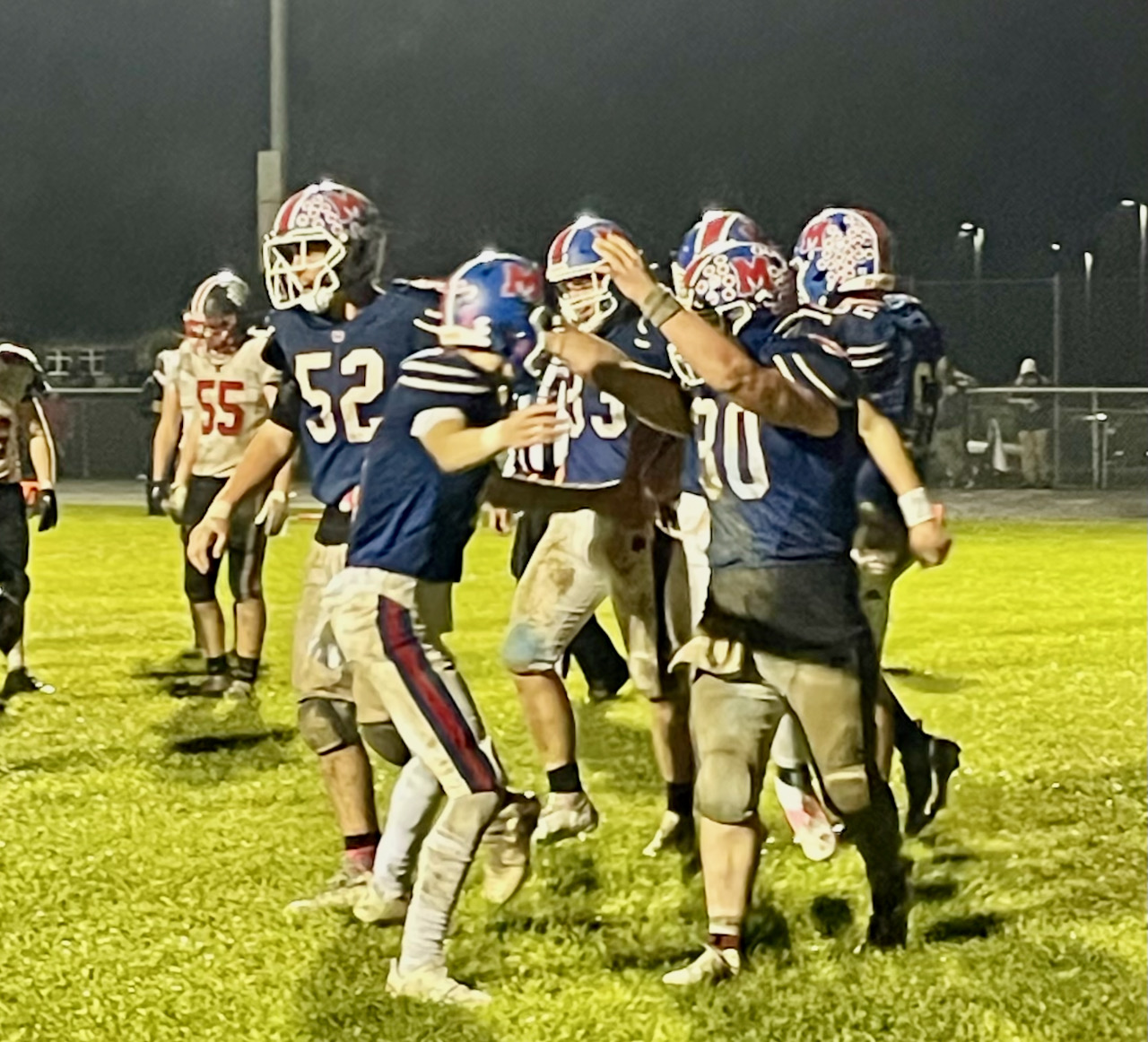 football players celebrate after a touchdown