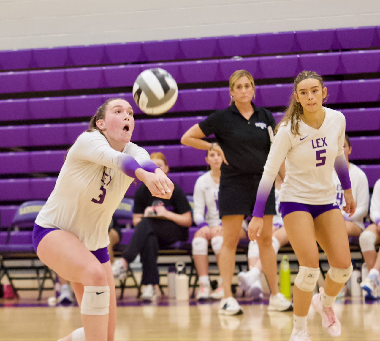 a volleyball player receives a serve