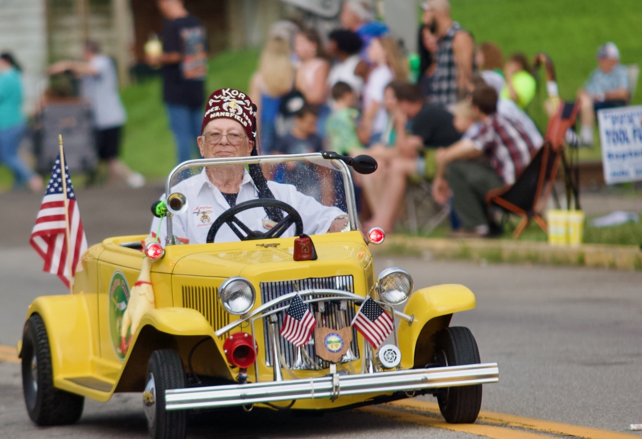 a Shriner drives a little car