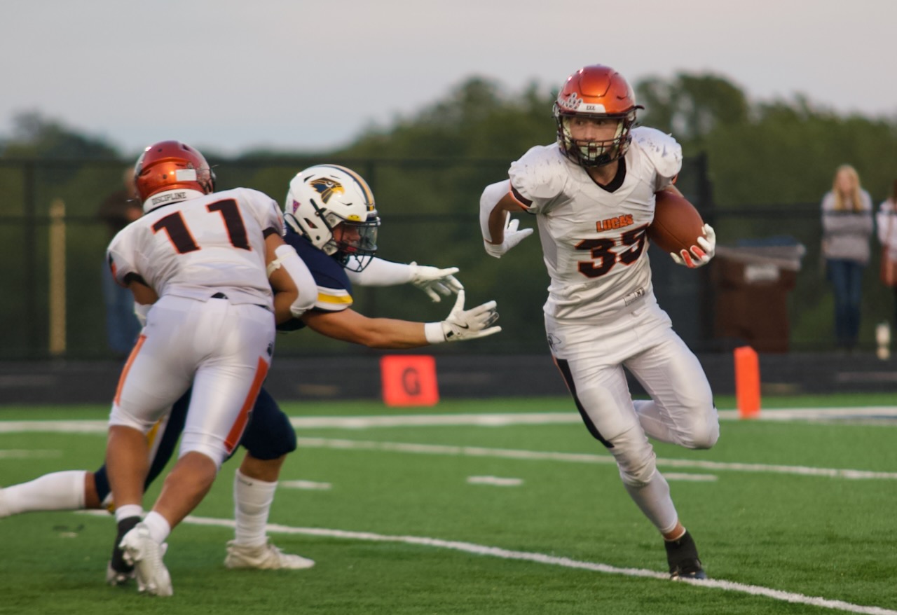 Football player runs the ball