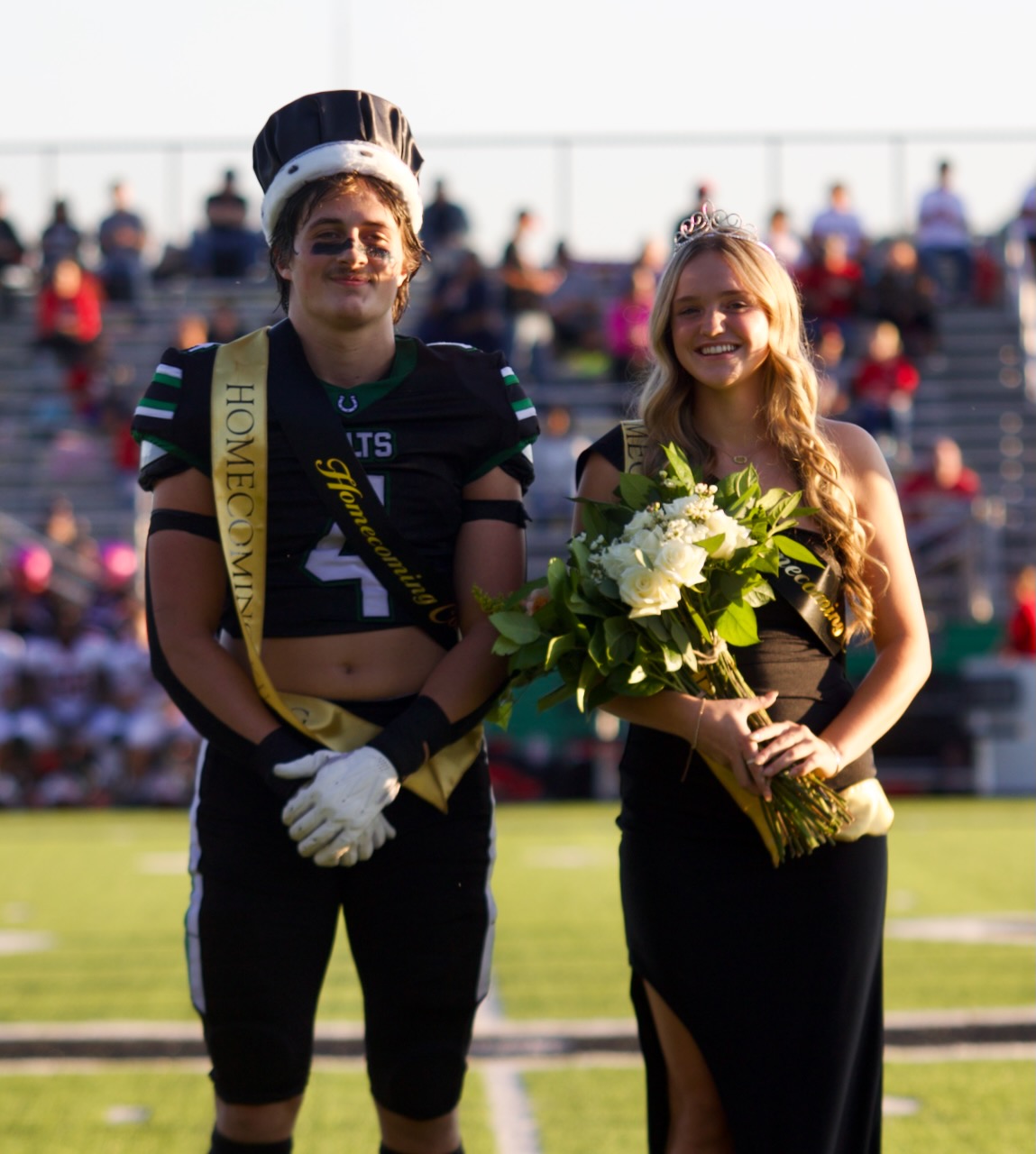 the Homecoming king and queen pose for photos