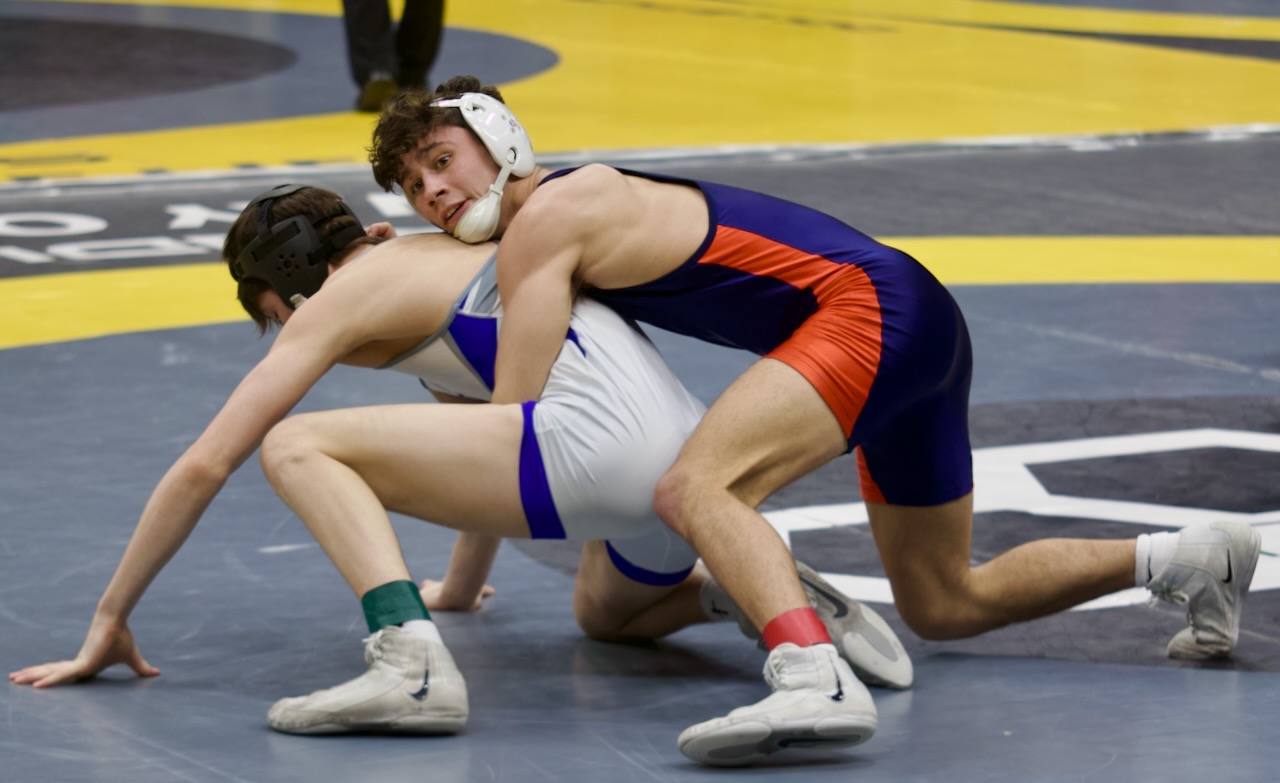 a wrestler controls his opponent